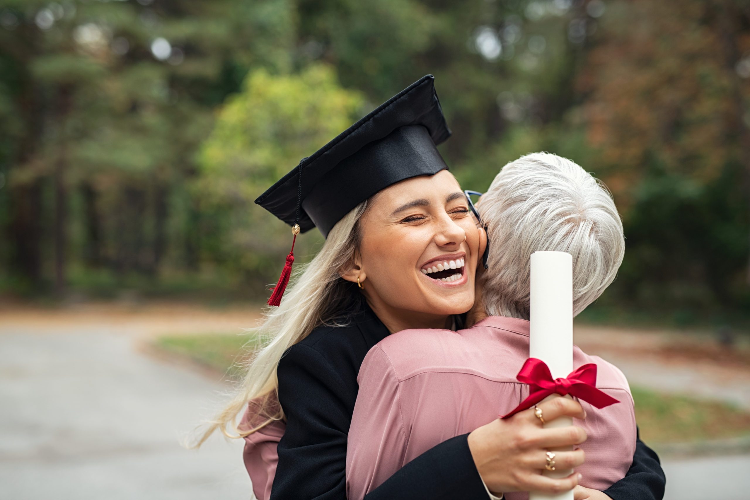 Girl and Grandmother Hugging at Graduation