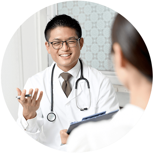 Male doctor or medical professional in white jacket talking to patient